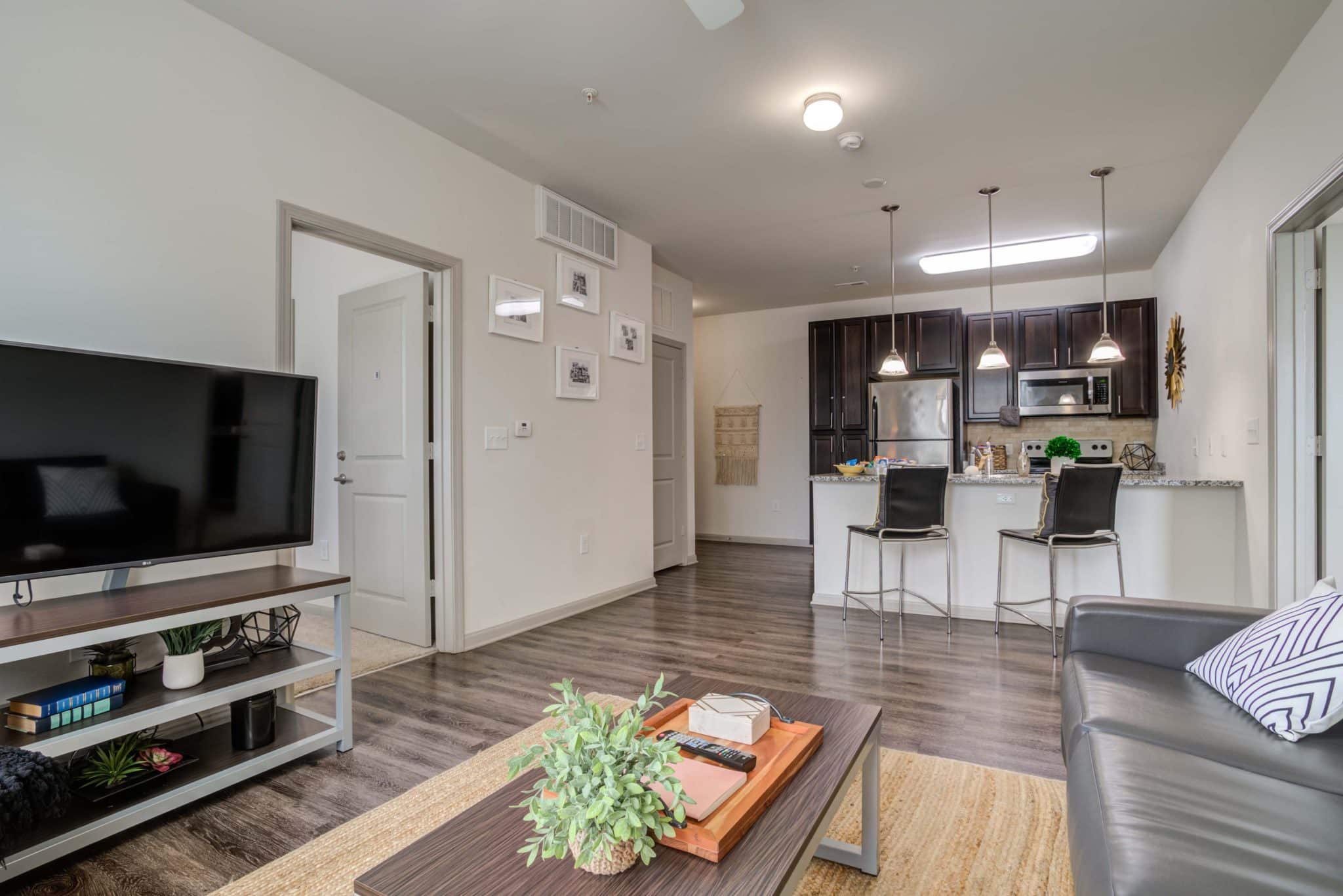 millennium one apartments near unc charlotte kitchen and living room