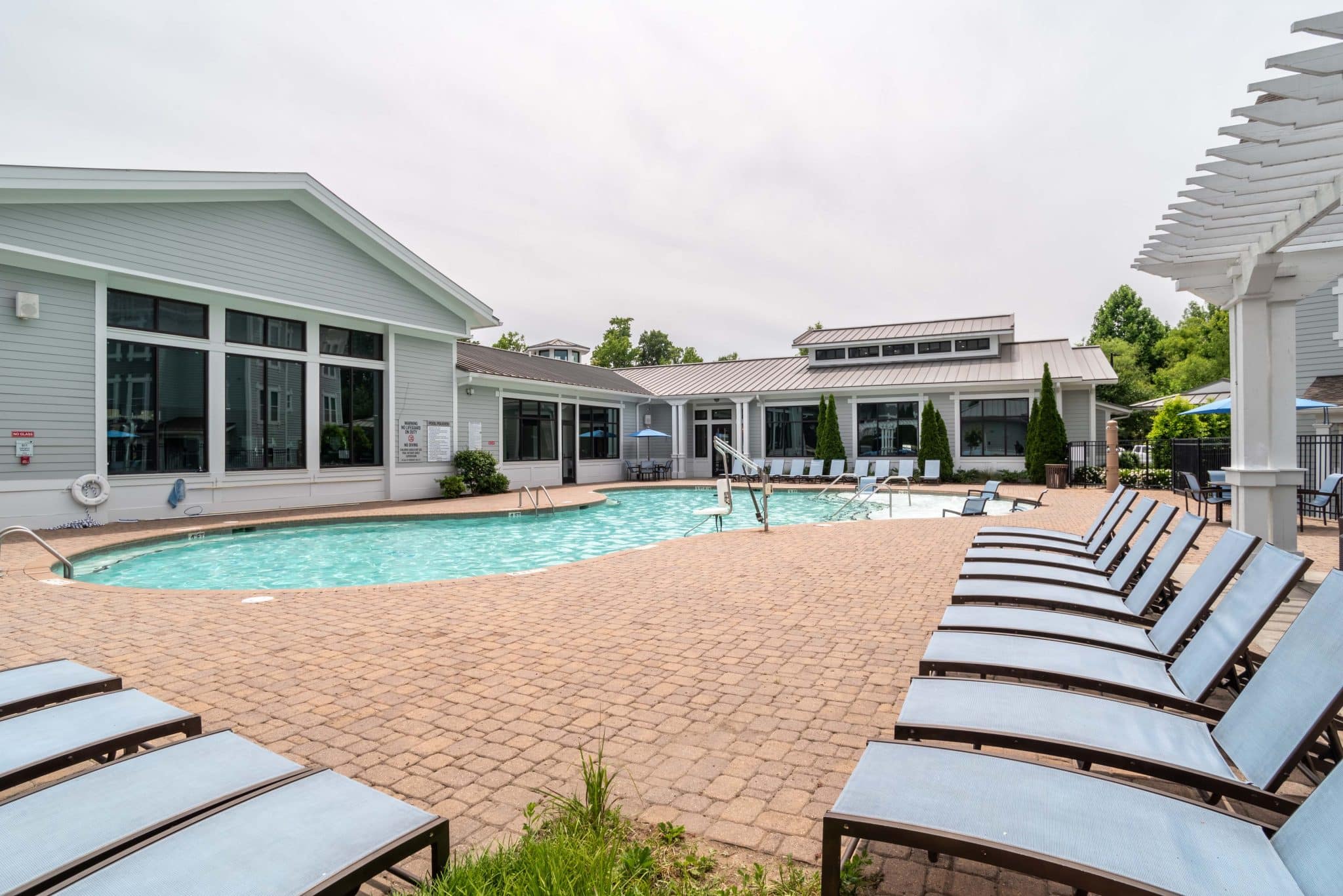 millennium one apartments near unc charlotte resort style pool lounge seating